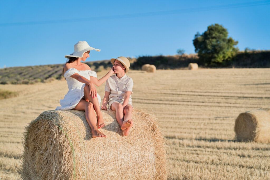 Mother and son at wheat barrels Valensole Eny Therese Photography