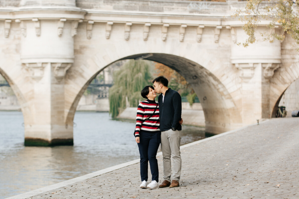 Honeymoon couple photoshoot along the Seine river Paris by Eny Therese Photography