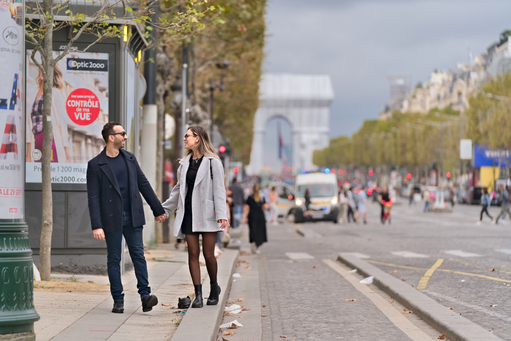 Couple photoshoot at Champs Elysee with arc de Triomphe wrapped