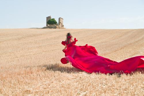 Red flying dress at wheat field Provence