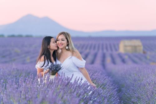 mother and daughter at lavender field during sunrise