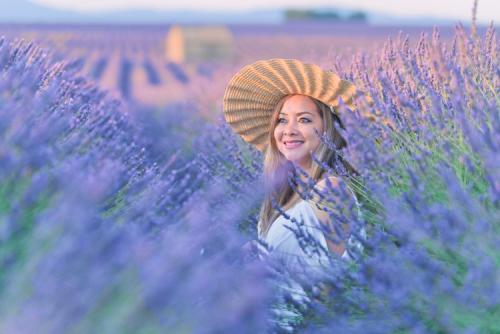 woman with strawhat at lavender field