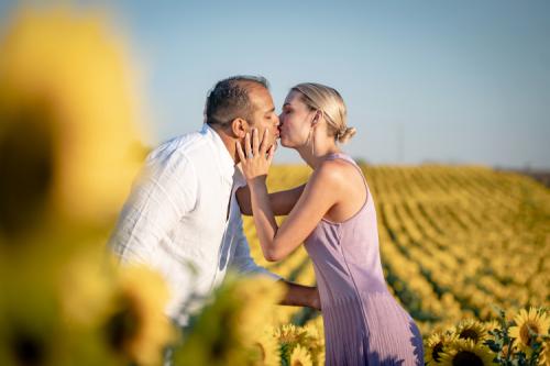 romantic couple at sun flower field